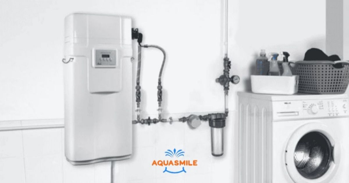 logo societe aquasmile et installation d'un adoucisseur d'eau au sel apic avec electricité.